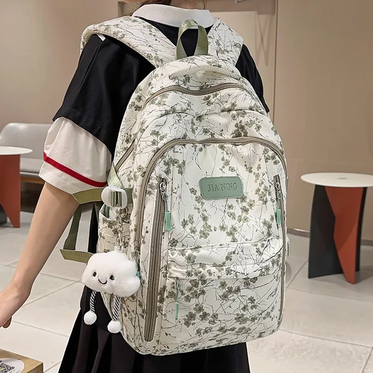 书包女生小学生2025新款初中生大容量印花背包潮流简约双肩包