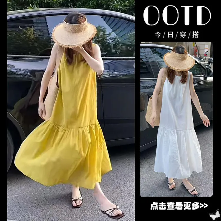 法式黄色挂脖露肩连衣裙女夏季2025新款气质宽松显瘦中长款A字裙