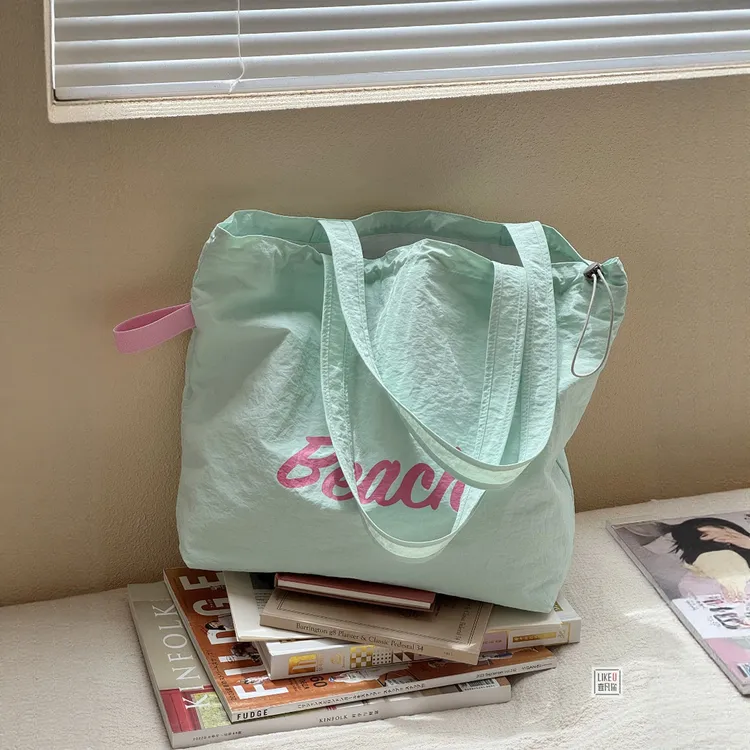 韩系ins慵懒字母印花尼龙抽绳单肩包日常百搭休闲学生通勤托特包