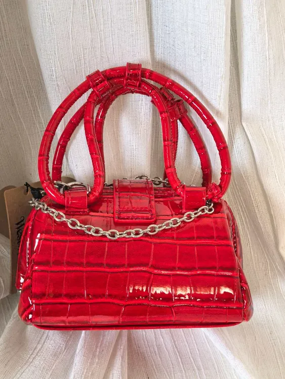 高档土星手提斜挎小废包