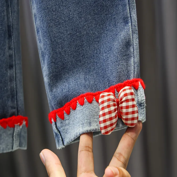 女童2025春秋新款红绒花边格子时尚新颖蝴蝶结装饰休闲牛仔裤子