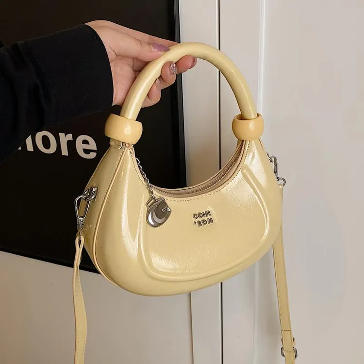 韩版小众手提月牙包包女式2025新款时尚洋气单肩包超火百搭斜挎包