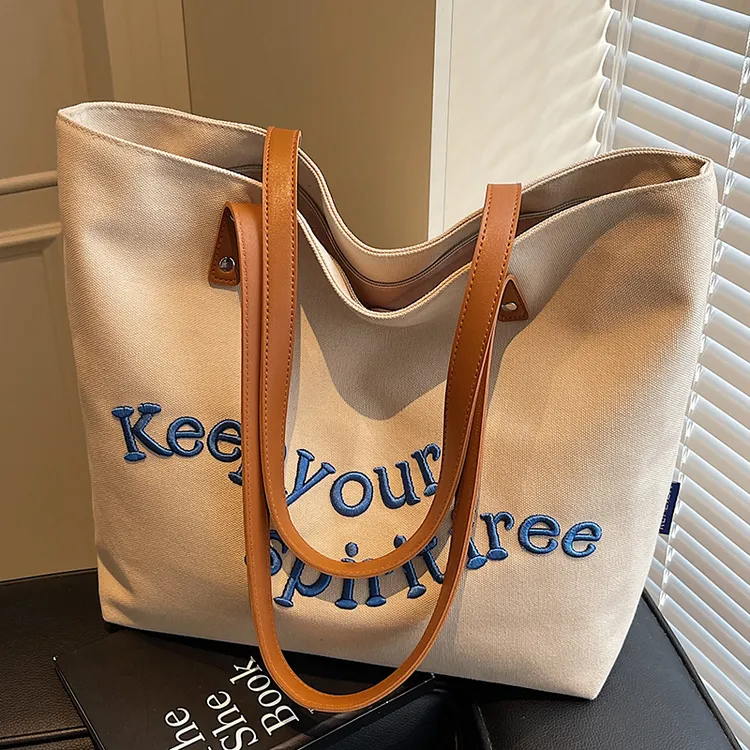 大容量包包女2025新款文艺百搭刺绣单肩包高级感大学生通勤托特包