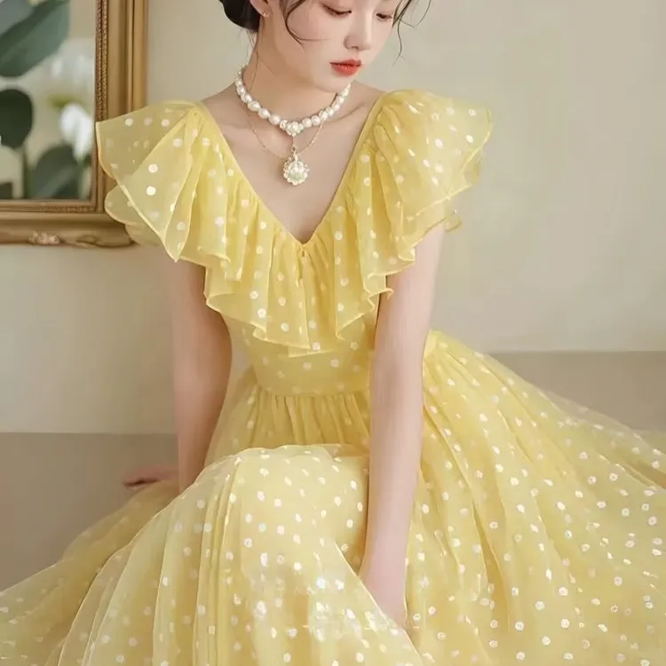 法式黄色波点连衣裙2025子女夏季新款收腰度假气质碎花裙子长裙