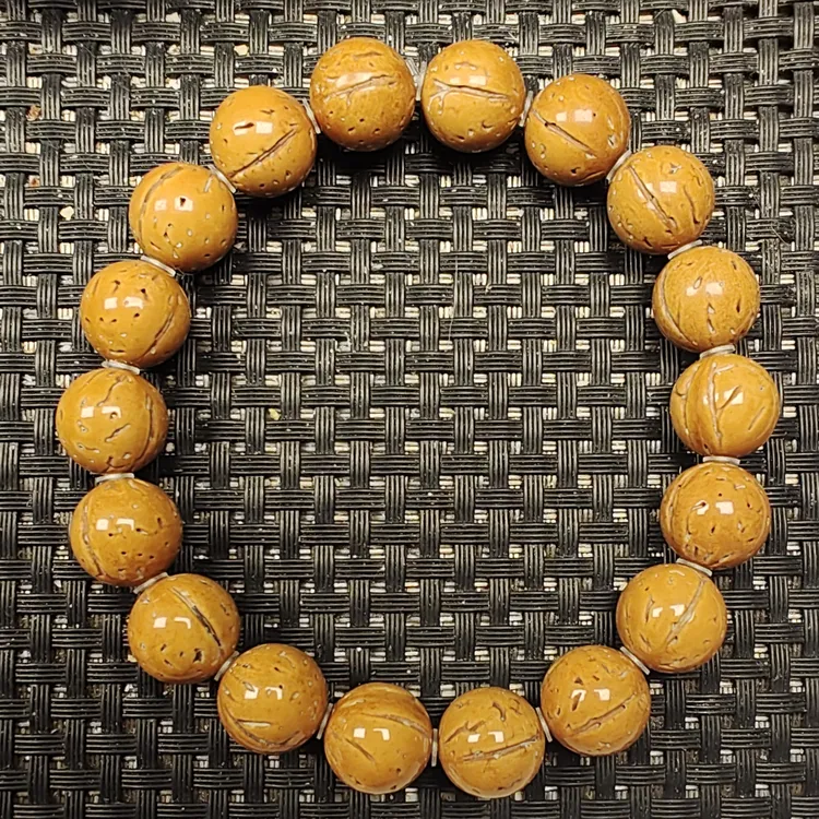 12尺寸精品野生黄皮桃核光珠手串 送手套线轴