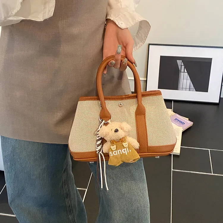 2025新款时尚撞色大容量手拎水桶包女简约休闲百搭通勤单肩斜挎包