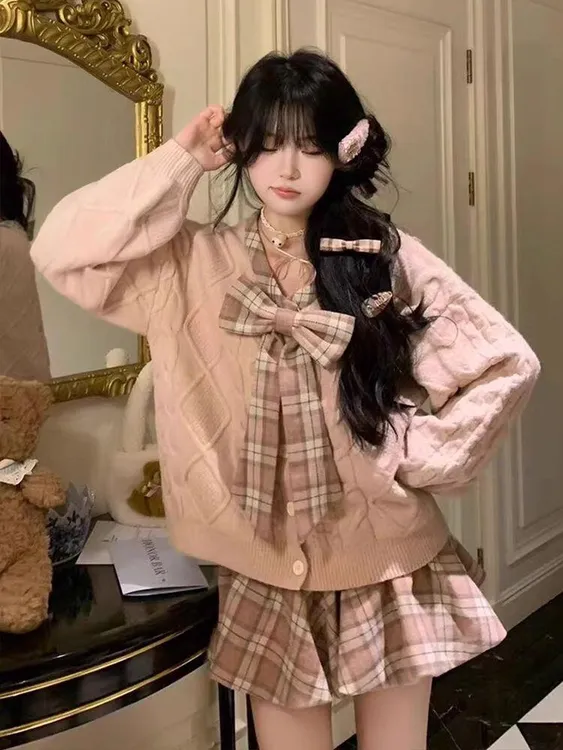88055#枫糖物语 减龄蝴蝶结毛衣+格子压褶短裙套装秋冬