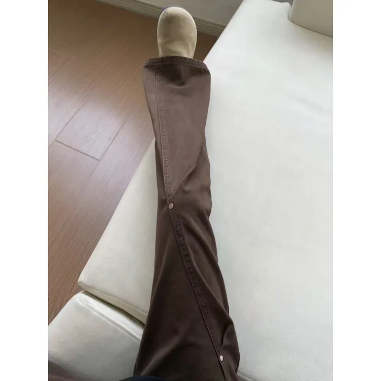 美式斜切铆钉牛仔裤男女秋冬季街头风加绒加厚高街休闲弯刀裤子