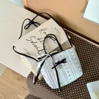 卷卷小众百搭泡泡纱手提斜跨包c059