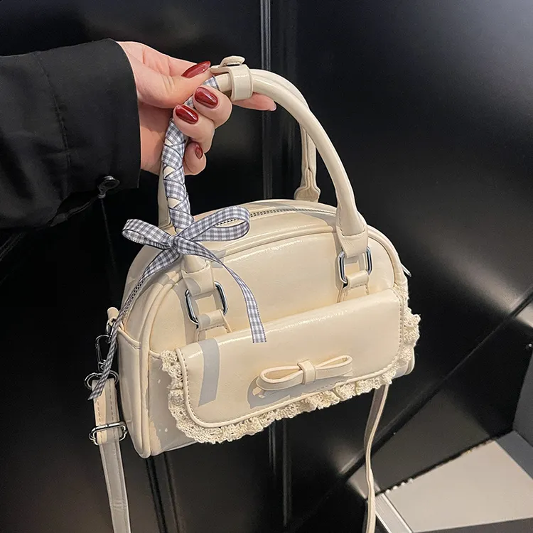 夏季超火小众蝴蝶结包包女2025新款百搭斜挎包高级感手提保龄球包