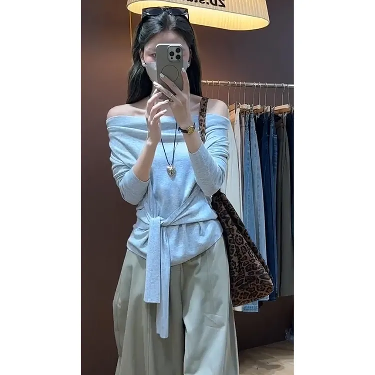 巨好看的轻熟早秋蓝色一字肩斜肩绑带针织衫女秋冬季修身露肩上衣