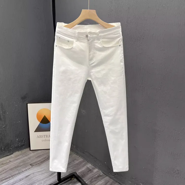 白色九分裤子男潮牌夏季薄款休闲牛仔裤男士修身小脚直筒弹力长裤