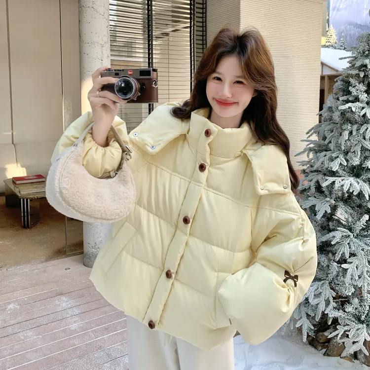 奶fufu黄色减龄白鸭绒外套女2025冬季新款设计感蝴蝶结印花羽绒服