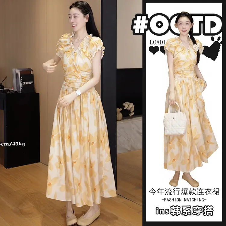 茶歇法式气质印花连衣裙女夏季2025新款港味别致小众v领收腰A字裙