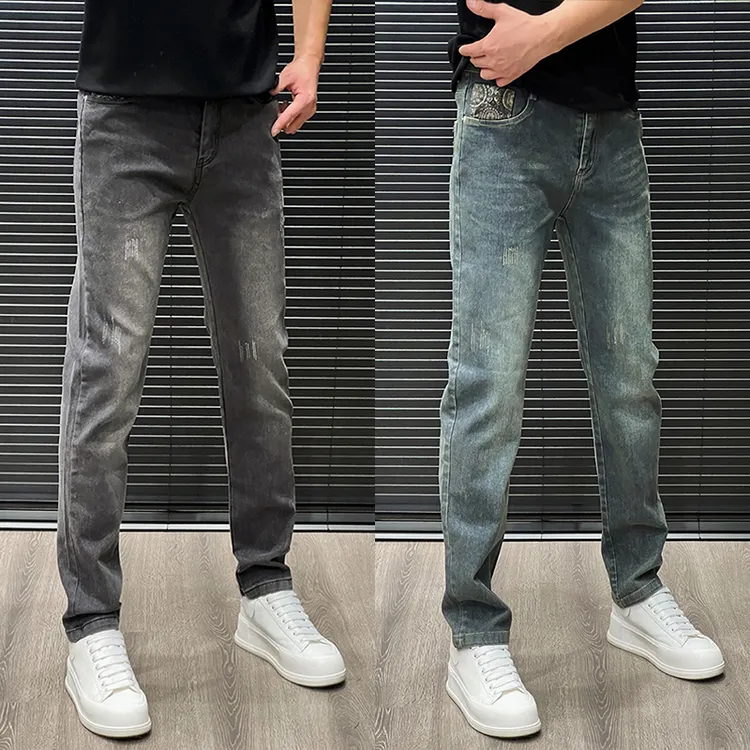 夏季百搭蓝色长裤小皮标裤子刮破设计小脚裤四季通用男水洗牛仔裤