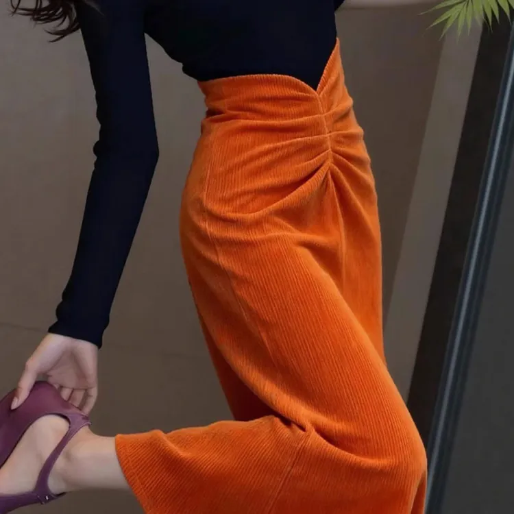 法式橘色灯芯绒包臀半身裙女2025新款秋冬气质巨好看雪尼尔长裙子