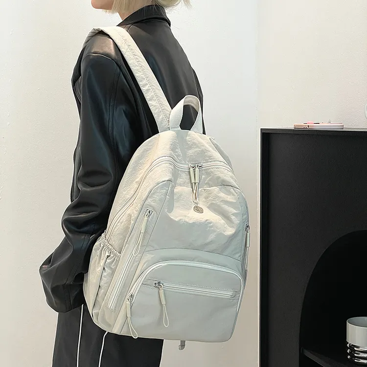 新品轻职多层文艺风防震双肩包女大学生书包简约防水大容量旅行包