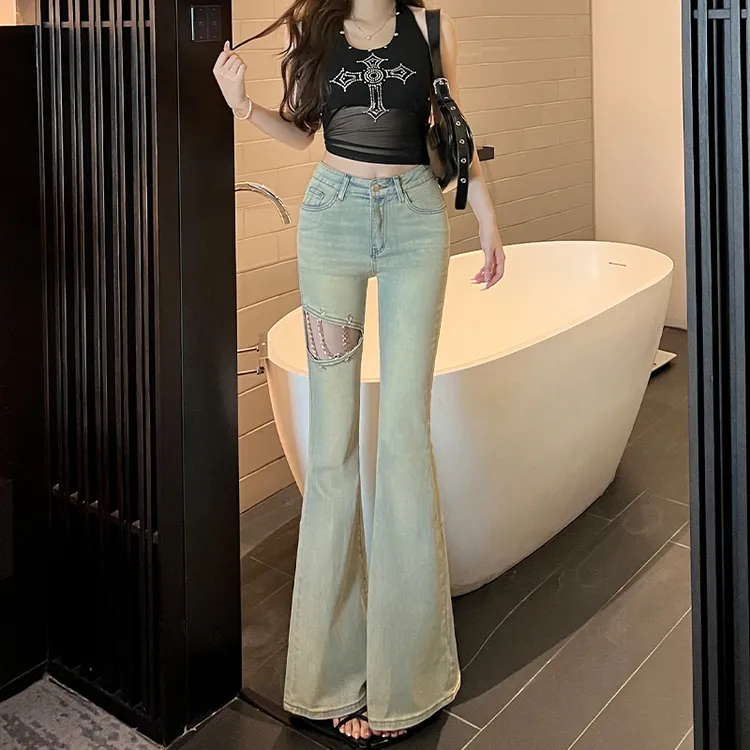 镂空链条微喇破洞牛仔裤女2025早秋新款显瘦修身设计感百搭喇叭裤