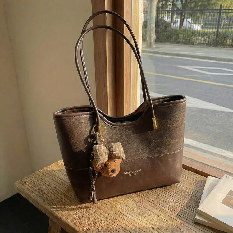 秋冬大容量撞色通勤包女2025新款轻奢磨砂托特包大容量单肩包女包