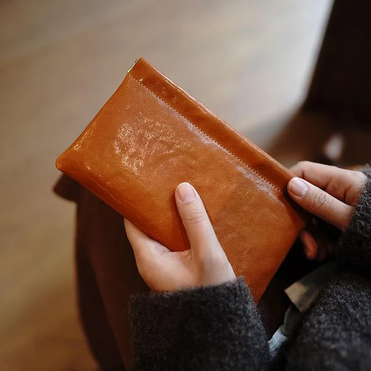 爆款耐脏简约复古夹口多功能真皮大容量零钱耳机文玩收纳包女士长