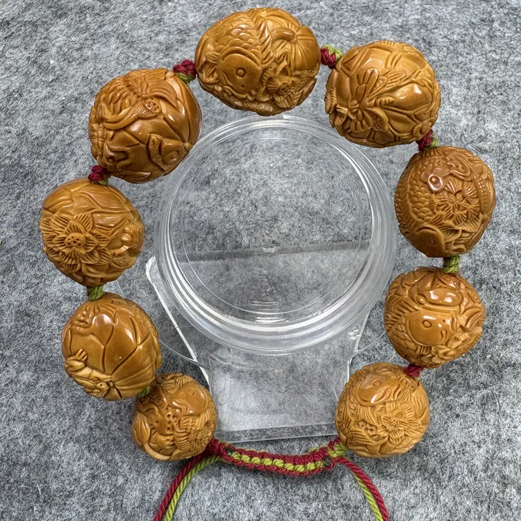 莲花鱼橄榄核雕手串2.0