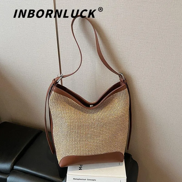 海边度假时尚百搭编织沙滩包包女2025夏季新款简约斜挎草编水桶包