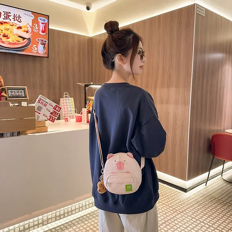 韩版日系可爱水豚单肩包2025新款卡通迷你斜挎包软萌小男女同款