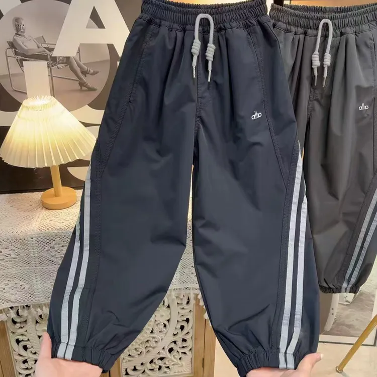舒适简约~2025男童秋季时髦休闲裤设计感拼接运动束脚裤S10591