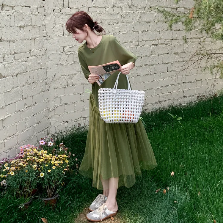 森系草绿色下摆网纱拼接连衣裙女2025夏装新款气质显瘦沙滩中长裙