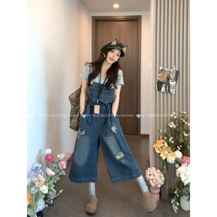 蓝色背带裤女2025夏季新款欧货工装七分阔腿裤宽松休闲牛仔连体裤