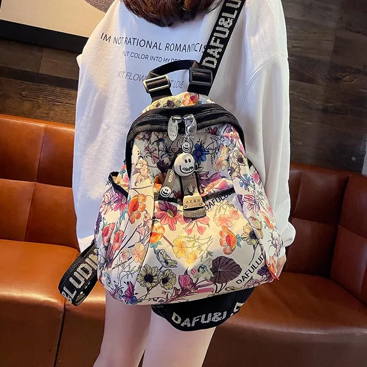 彩色花朵大容量双肩包女2025新款时尚高级感书包牛津布背包旅行包
