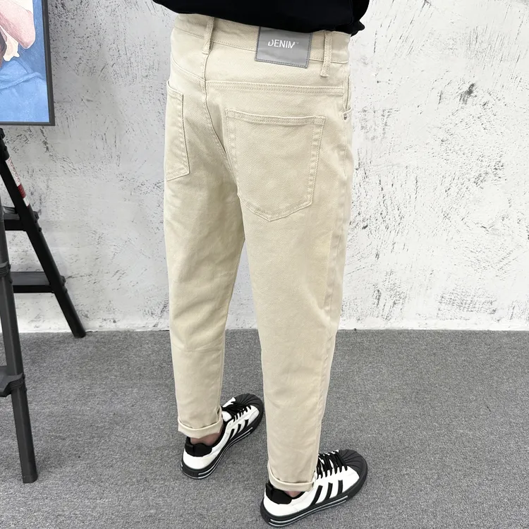 微锥牛仔裤男秋冬潮牌美式高街复古水洗百搭宽松简约小脚裤米黄色