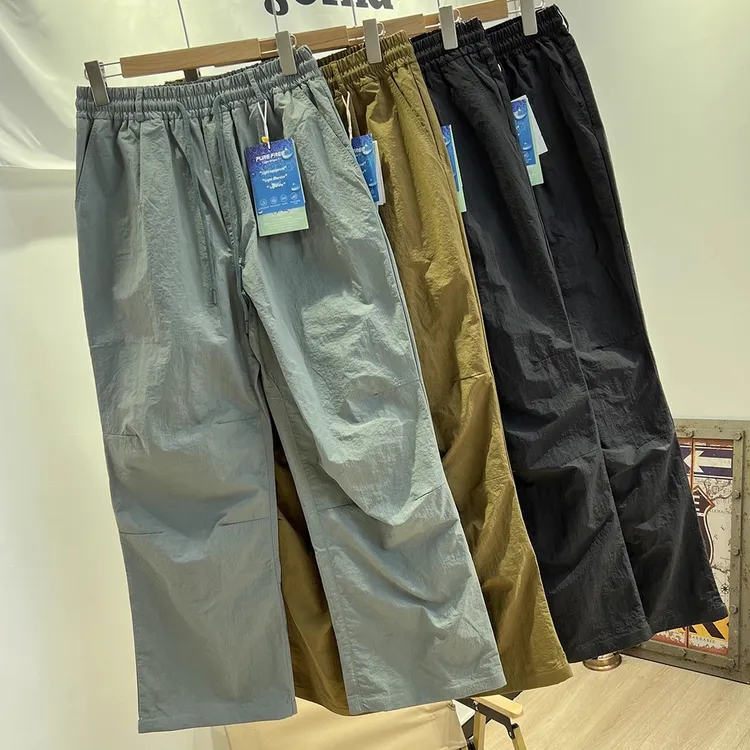 西班牙订单 户外防风防水软壳冲锋裤男女宽松休闲阔腿休闲运动裤