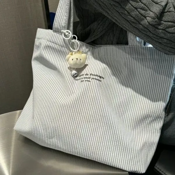 新款2024大容量简约休闲条纹帆布包时尚青年通勤单肩托特懒洋洋尼