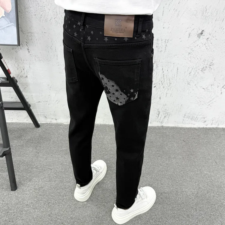 纯黑色轻奢高档牛仔裤男冬季潮牌美式五角星印花弹力修身小脚长裤