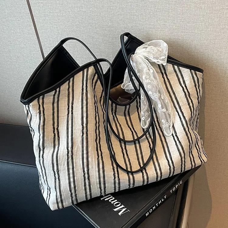 休闲大容量包包女2025新款通勤百搭帆布单肩包大学生上课包托特包