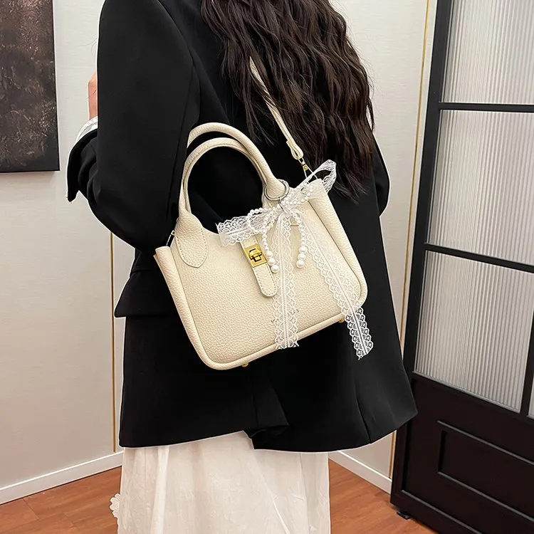 25初春ins时尚气质网红爆款百搭洋气女包韩版蝴蝶结丝巾水桶包