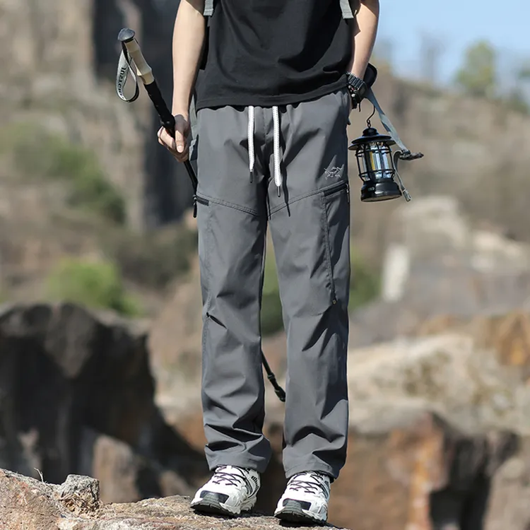 始祖刺绣鸟男户外野营登山冲锋裤防风防水速干免烫运动软壳休闲裤