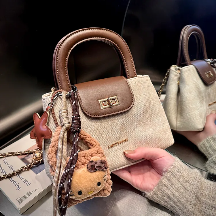 艾米兔 X COOLE女包2025新款通勤百搭复古风小众设计手提斜挎包