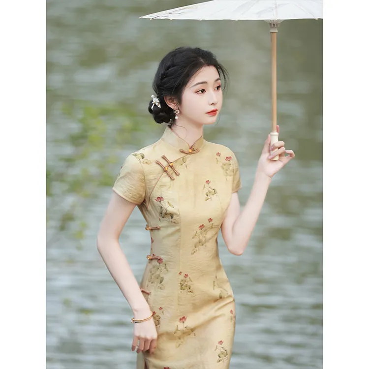 改良黄色旗袍2023新款年轻款少女新中式国风长款高端送考连衣裙夏