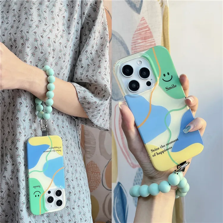 撞色几何笑脸薄荷绿手拎圆环适用苹果16/14手机壳iphone15pro防摔