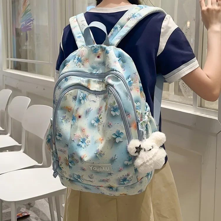 书包女初中小学女生小众卡通印花双肩包可爱大容量旅行轻便背包