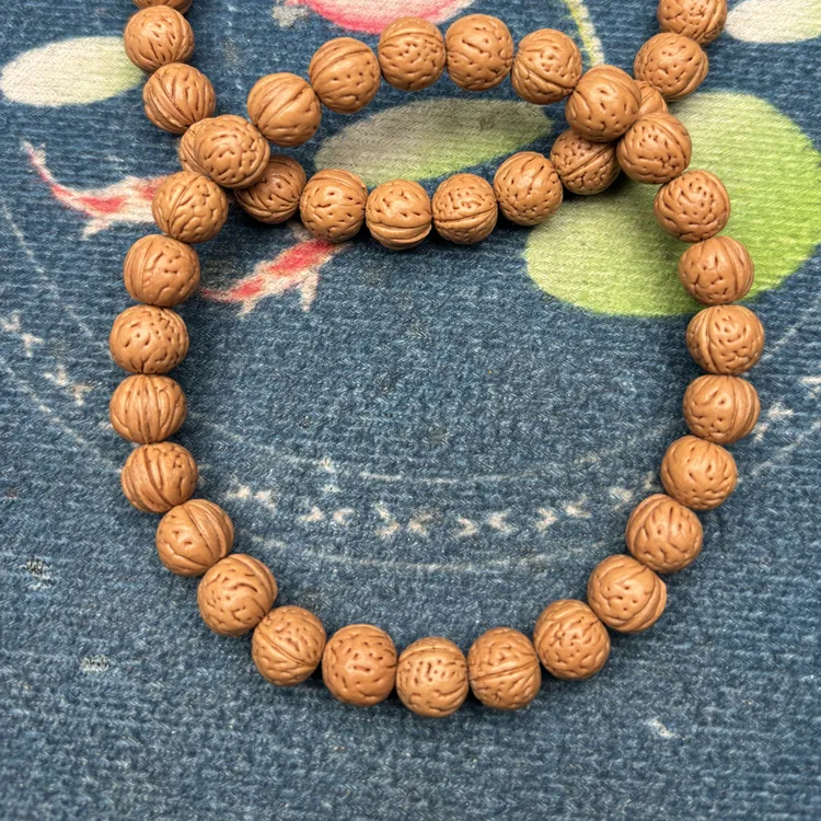 野生小桃核手串，原皮色，边度1.0高0.9全品