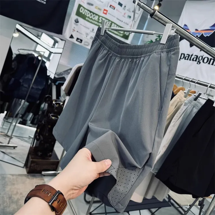 特大码300斤轻薄透气激光打孔男士夏季运动户外跑步健身休闲短裤.