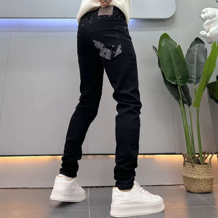 设计款个性星星印花黑色牛仔裤男修身小脚秋季新款韩版弹力长裤