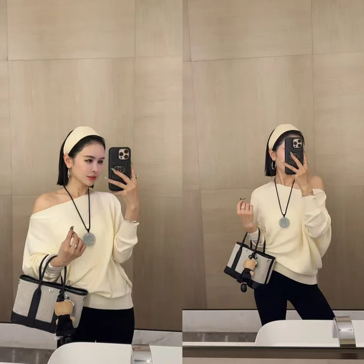 斜肩宽松一字肩针织毛衣.