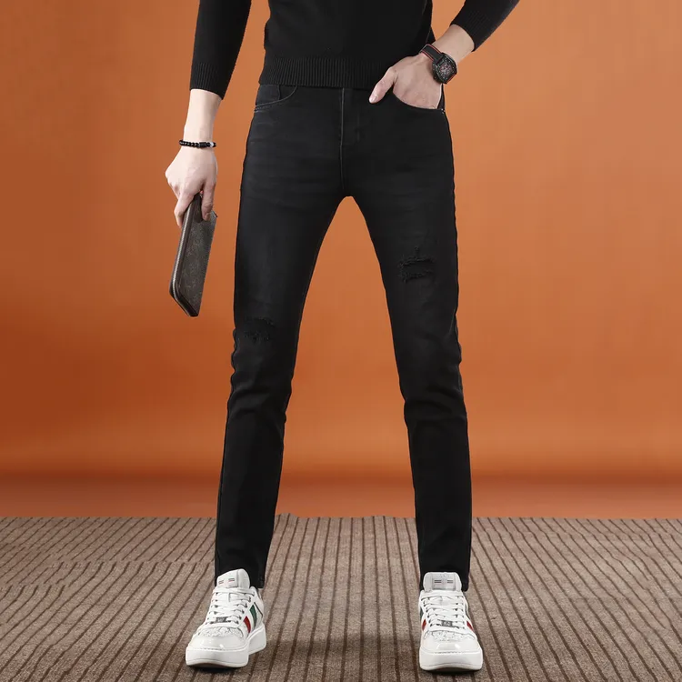 秋冬款高端男士牛仔裤爆款2025新款破洞补丁休闲修身小脚裤子男款