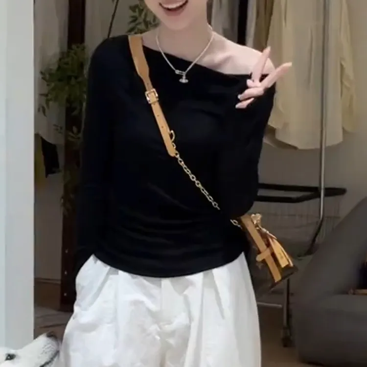 法式不规则斜肩针织长袖T恤女2025早秋新款修身露肩后背镂空上衣