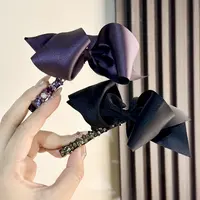 东大门 韩系蝴蝶结水钻弹簧夹精致优雅款百搭1078