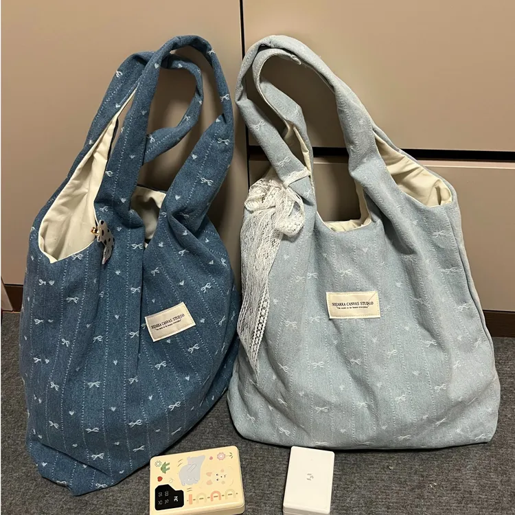 韩系牛仔刺绣帆布包女2026新款大容量蝴蝶结单肩托特包通勤腋下包